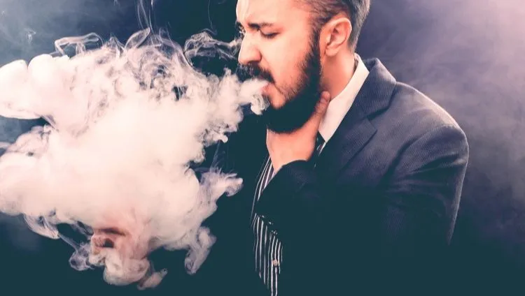 Man vaping - how to clean a vaporizer