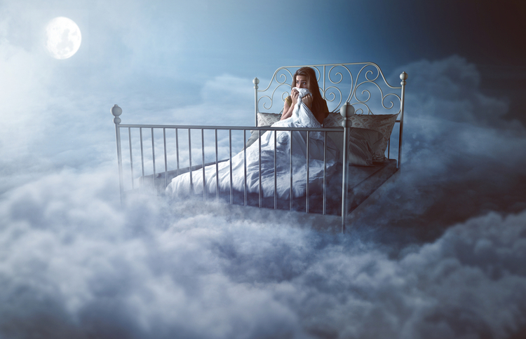 "A woman sitting anxiously on a floating bed surrounded by night clouds — symbolizing vivid dreams, sleep disturbances, and the possible impact of cannabinoids on dreaming."