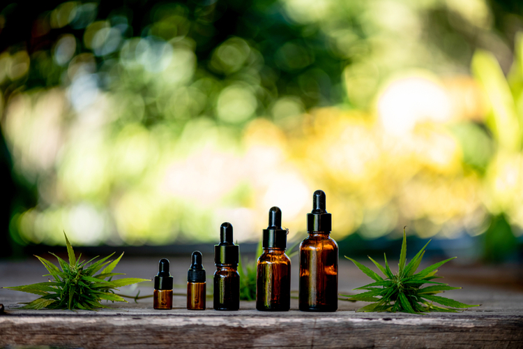 Various sizes of bottles with CBD oil
