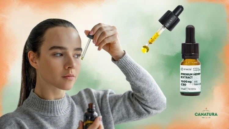 Young woman dosing CBD oil, next to her a dropper with CBD oil and Enecta CBD oil
