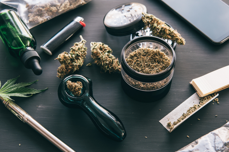 CBD-rich industrial hemp flowers, oil, grinder, rolling papers