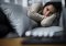 Woman lying on a couch with anxiety or exhaustion – illustrative photo for the topic of antidepressants and CBD.