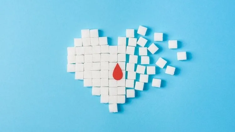 A symbol of diabetes made from sugar cubes with a drop of blood – the connection between diabetes and CBD support
