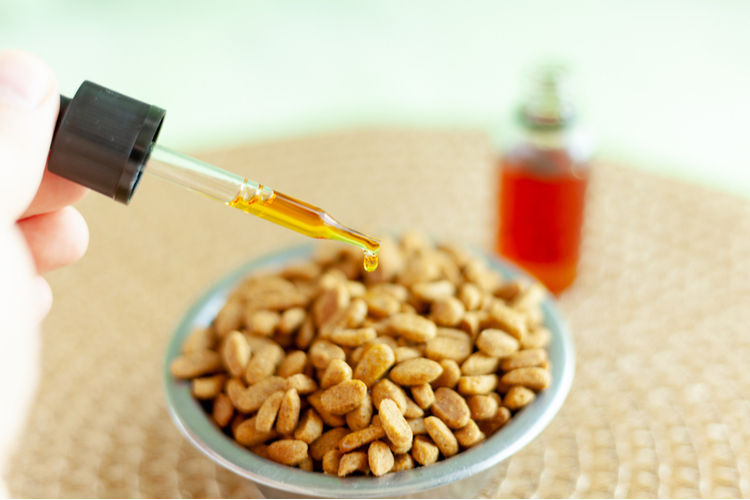 CBD dispensed onto granules using a dropper