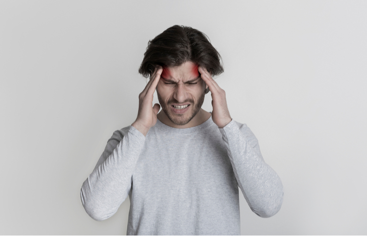 A man depicted with excruciating headache