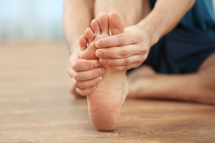 The leg that a person massages because it hurts.